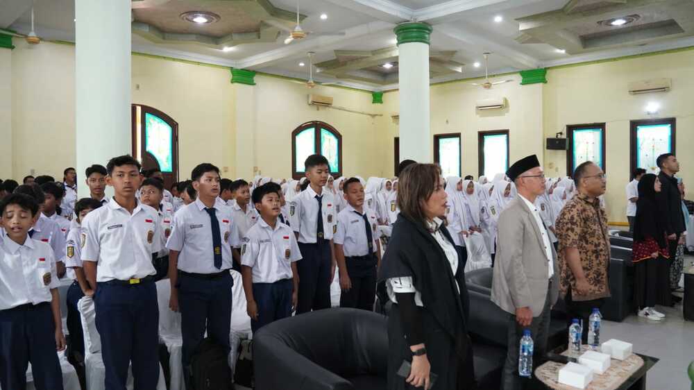 Gambar: Kegiatan literasi digital dan sosialisasi PP Tunas berlangsung interaktif di aula SMP Muhammadiyah 57 Medan, Sabtu (13/6/2026). (Foto: Humas BBLSDM Komigi Medan)